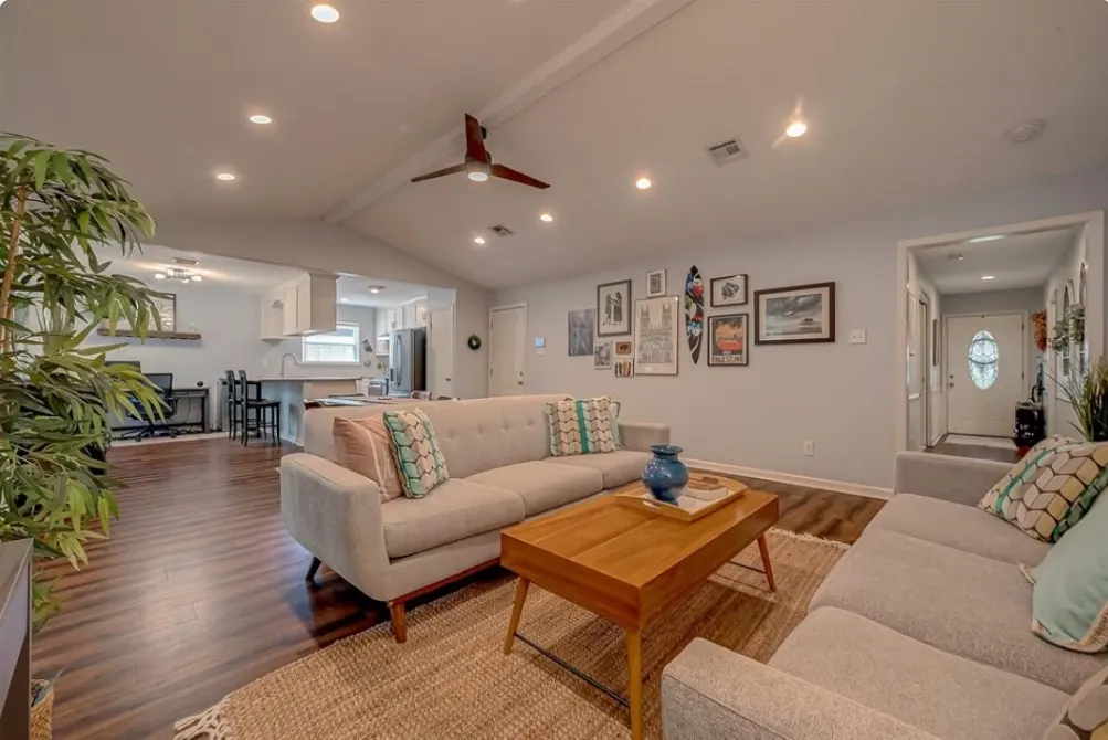 The open-plan living room and kitchen inside a Houston women’s sober living home